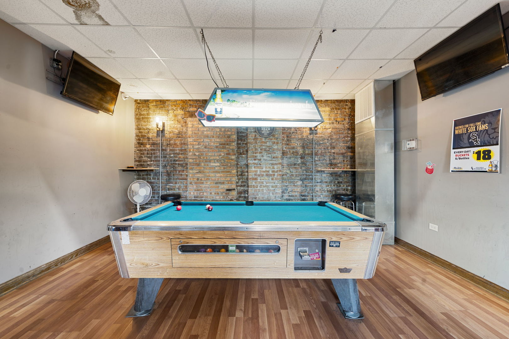 6021 South Archer Road Summit, IL 60501 - Photo 24 of 40 a room with pool table windows and chandelier