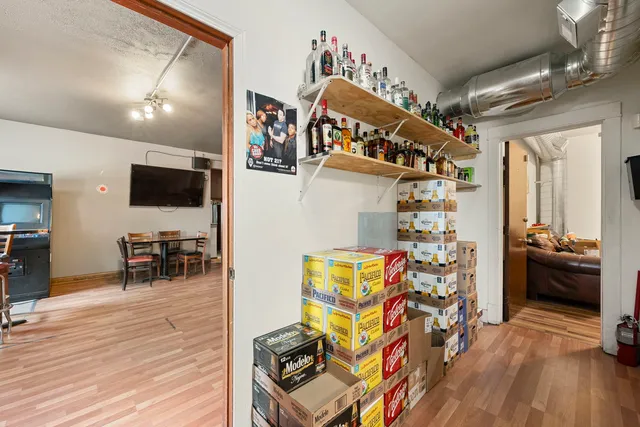 a view of a livingroom with furniture and a flat screen tv
