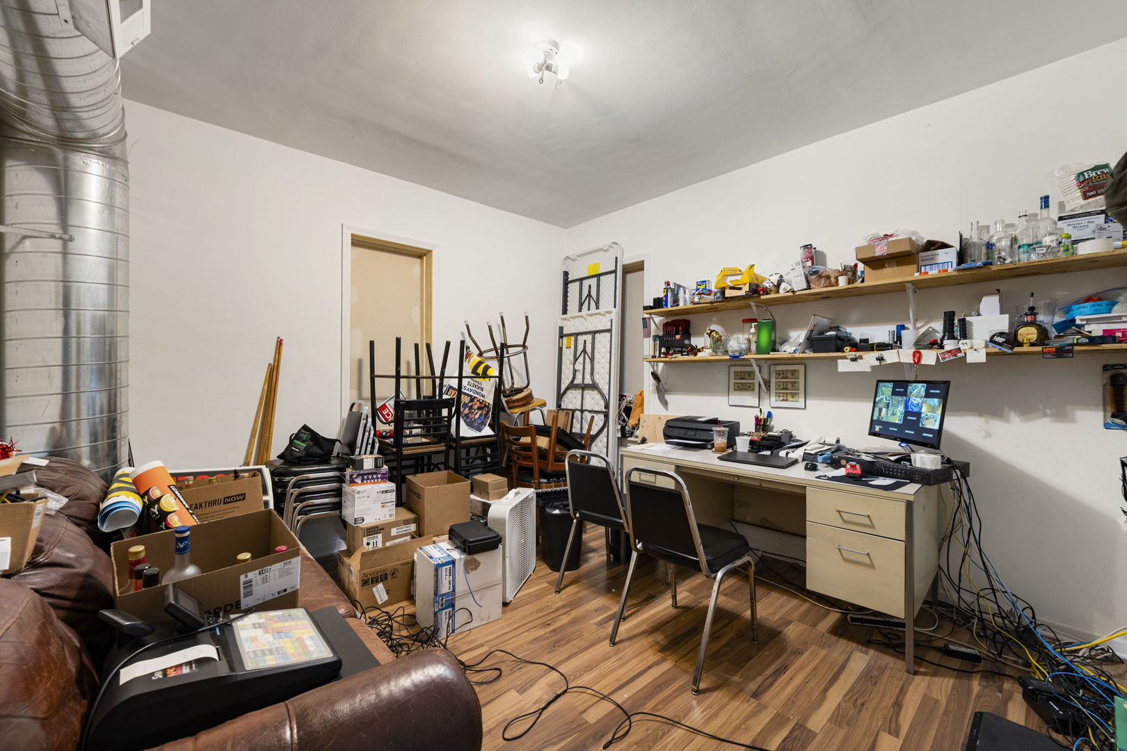 6021 South Archer Road Summit, IL 60501 - Photo 33 of 40 a view of a workspace with furniture and a wooden floor