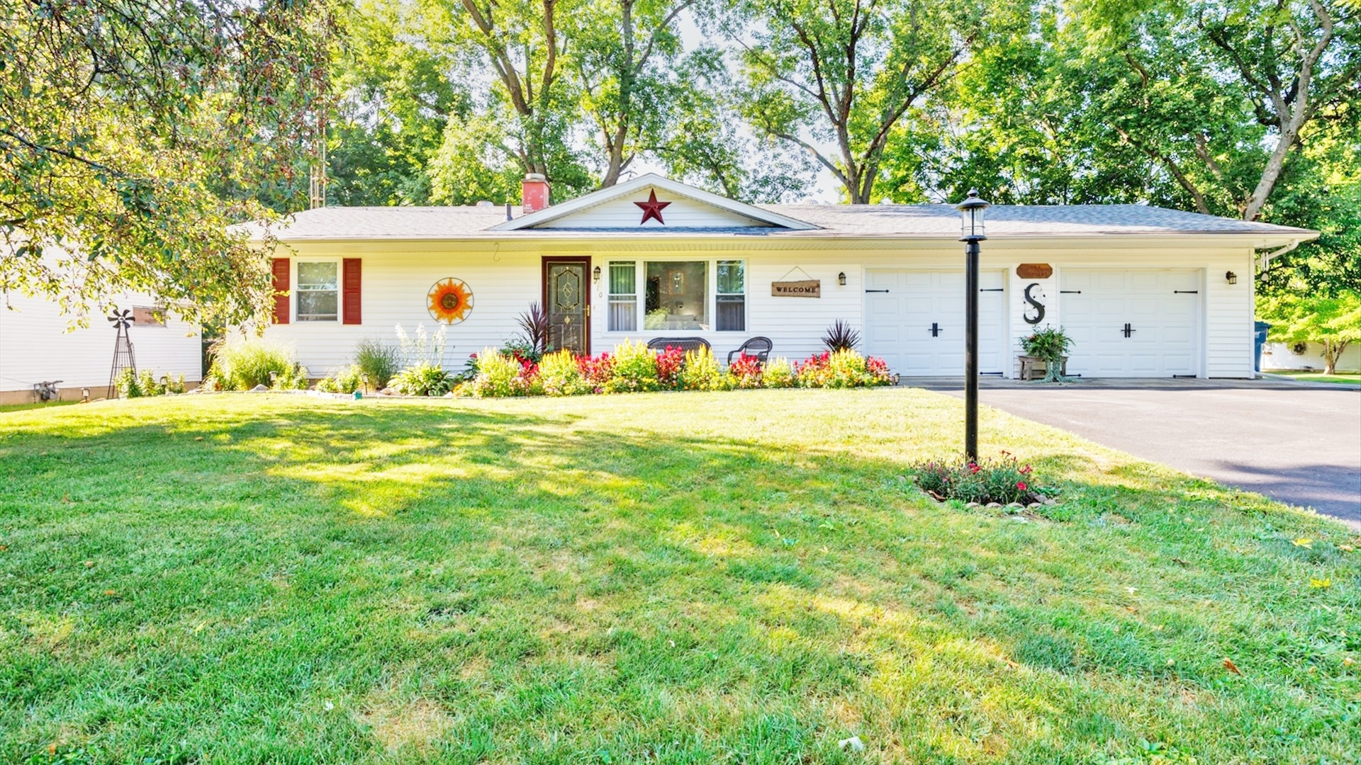 a front view of a house with a yard patio and fire pit
