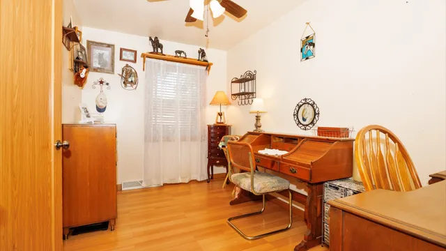 a room with a table and a chandelier