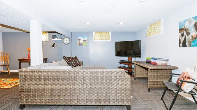 a living room with a couch and a flat screen tv