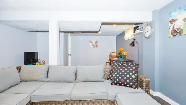 a bathroom with a sink mirror and toilet