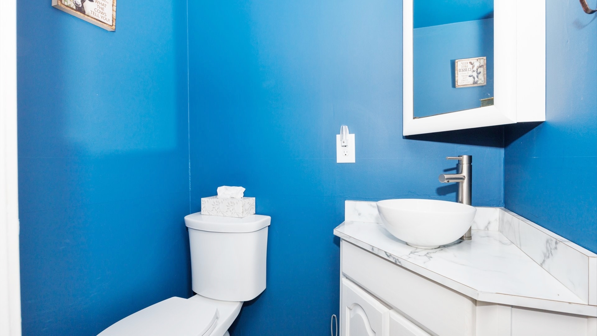 210 West North Street Colfax, IL 61728 - Photo 26 of 40 a bathroom with a sink mirror and toilet