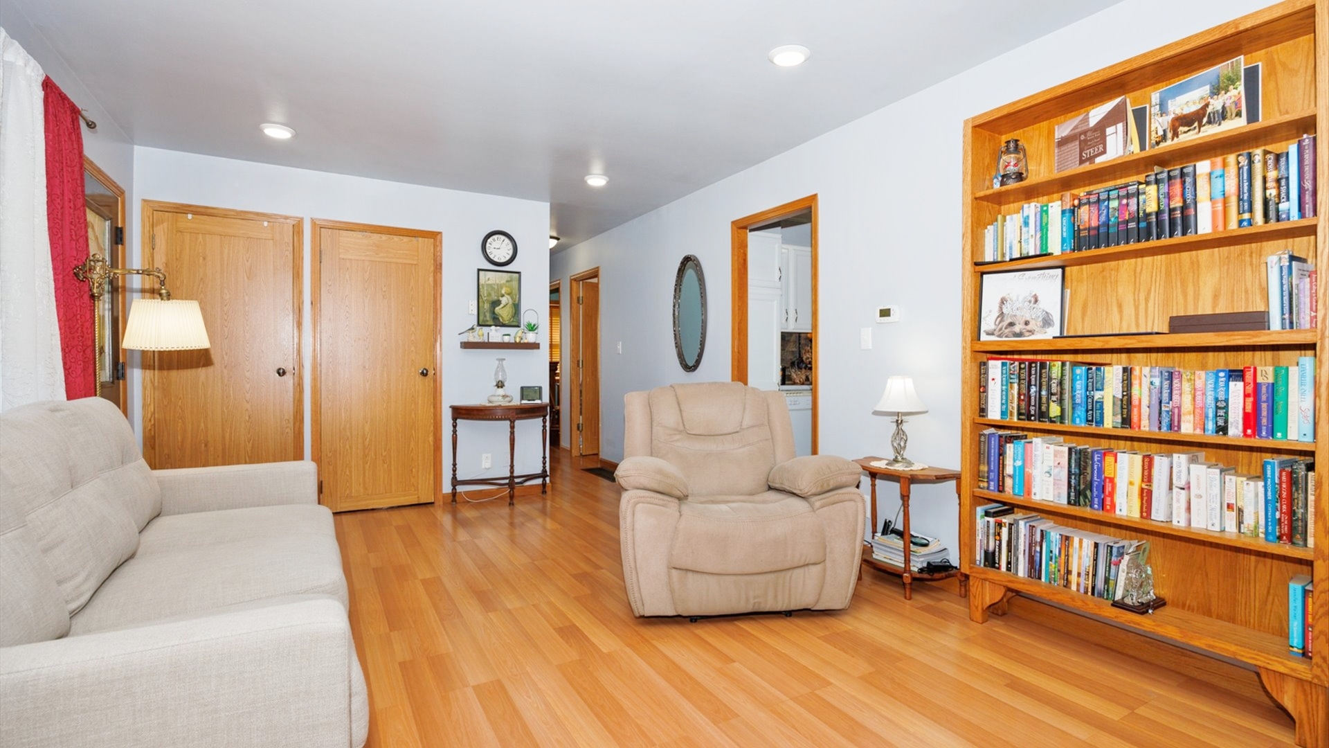 210 West North Street Colfax, IL 61728 - Photo 6 of 40 a living room with furniture and a book shelf