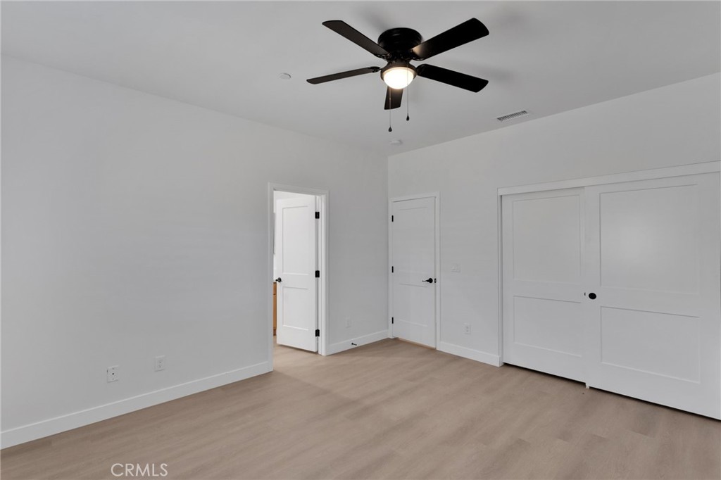 15561 Desert Star Road Apple Valley, CA 92307 - Photo 13 of 22 a view of a big room with a ceiling fan