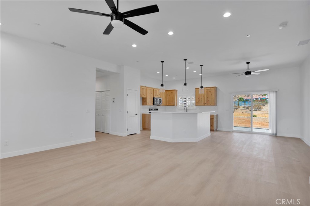 15561 Desert Star Road Apple Valley, CA 92307 - Photo 5 of 22 a view of a kitchen with microwave and cabinets