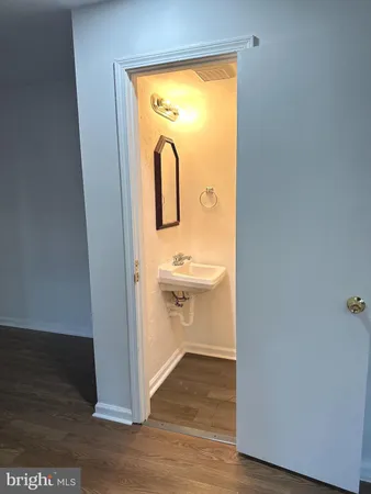 a view of a bathroom with sink and mirror