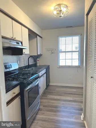 a kitchen with a stove and a microwave