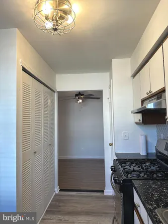 a kitchen with stainless steel appliances granite countertop a stove and a refrigerator
