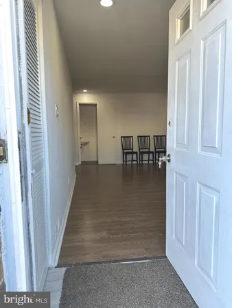a view of dining room with floor to ceiling window and stairs