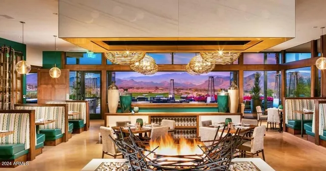 a view of a patio with a table and chairs