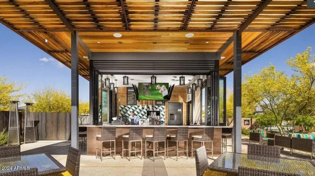 a view of a chairs and table in the patio