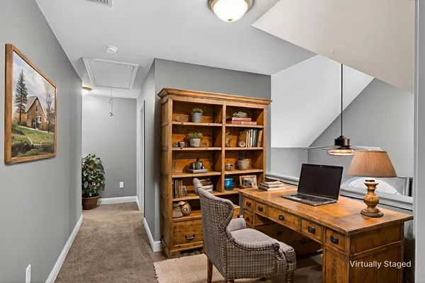 a workspace with furniture and book shelf