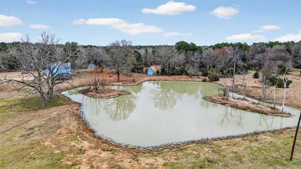 a view of a swimming pool with a yard and mountain view