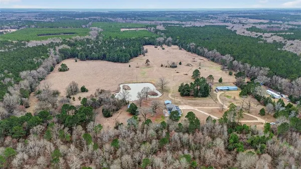 an aerial view of a house with mountain view