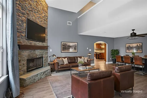 a living room with furniture and a fireplace