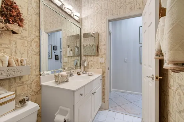 a bathroom with a double vanity sink mirror and shower