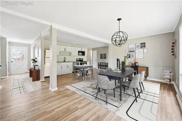 a view of a dining room with furniture window and wooden floor