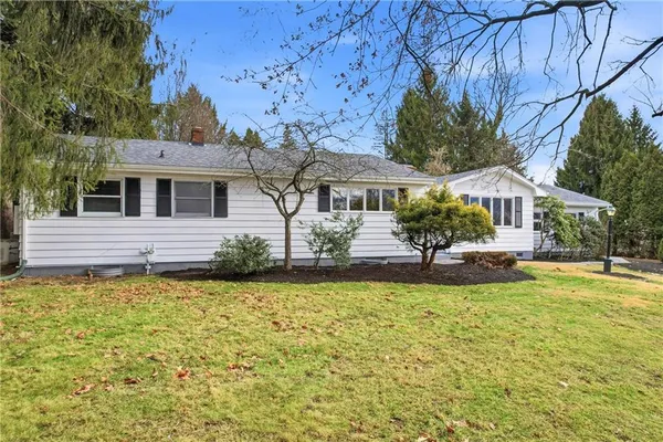 a front view of a house with swimming pool
