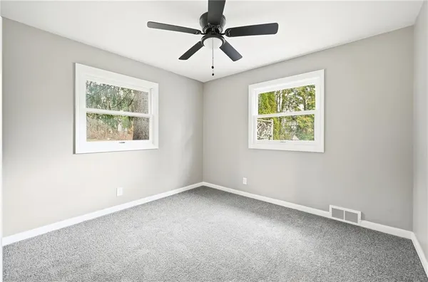 a view of an empty room with a window