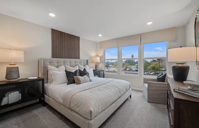 a bedroom with a bed and a couch