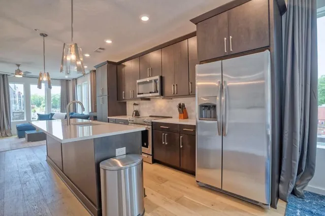 a view of a dining room with furniture and a window