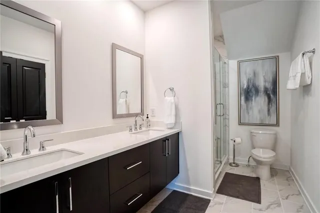 a bathroom with a glass door shower