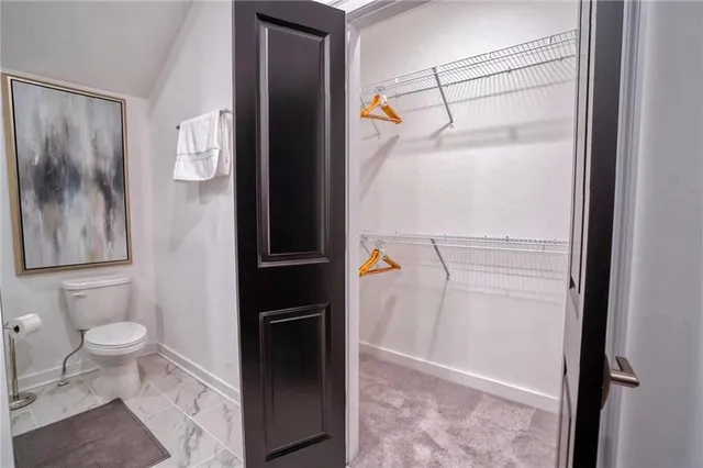 a living room with furniture and white walls