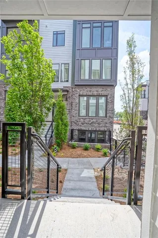 a view of a brick building next to a yard