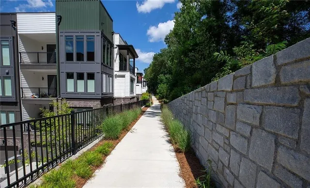 a view of a backyard with sitting area