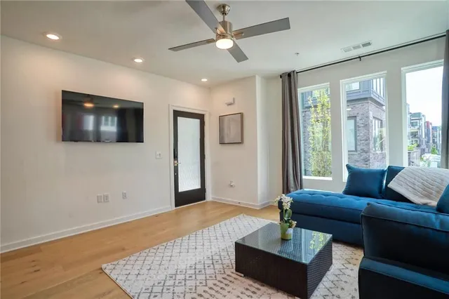 a living room with furniture and a window