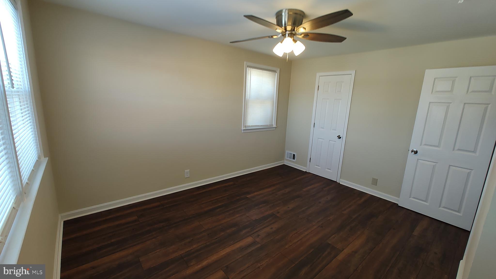 2247 Graythorn Road Middle River, MD 21220 - Photo 14 of 29 a view of an empty room with window and wooden floor