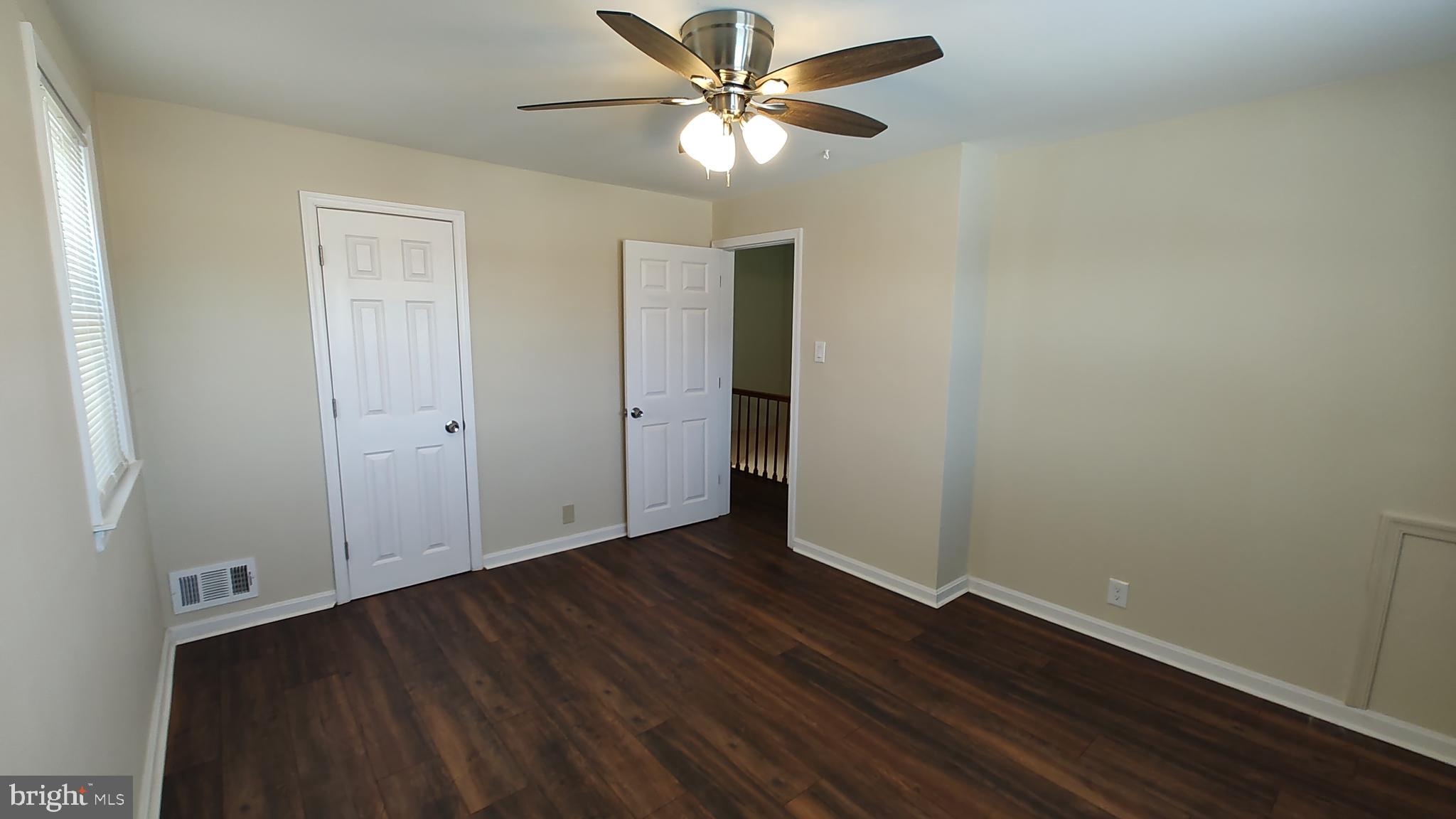 2247 Graythorn Road Middle River, MD 21220 - Photo 15 of 29 an empty room with wooden floor closet and fan