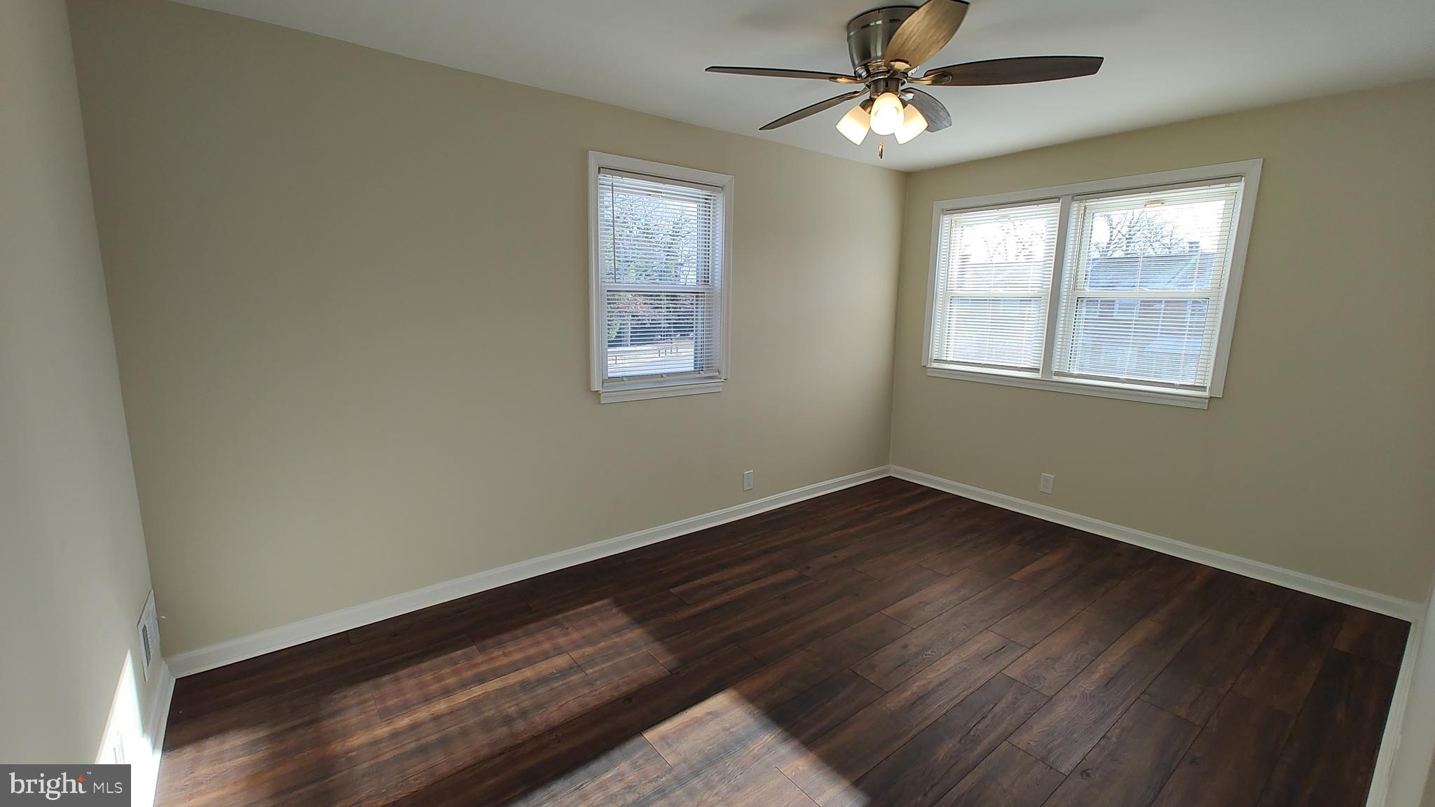 2247 Graythorn Road Middle River, MD 21220 - Photo 18 of 29 a view of an empty room with wooden floor and a window