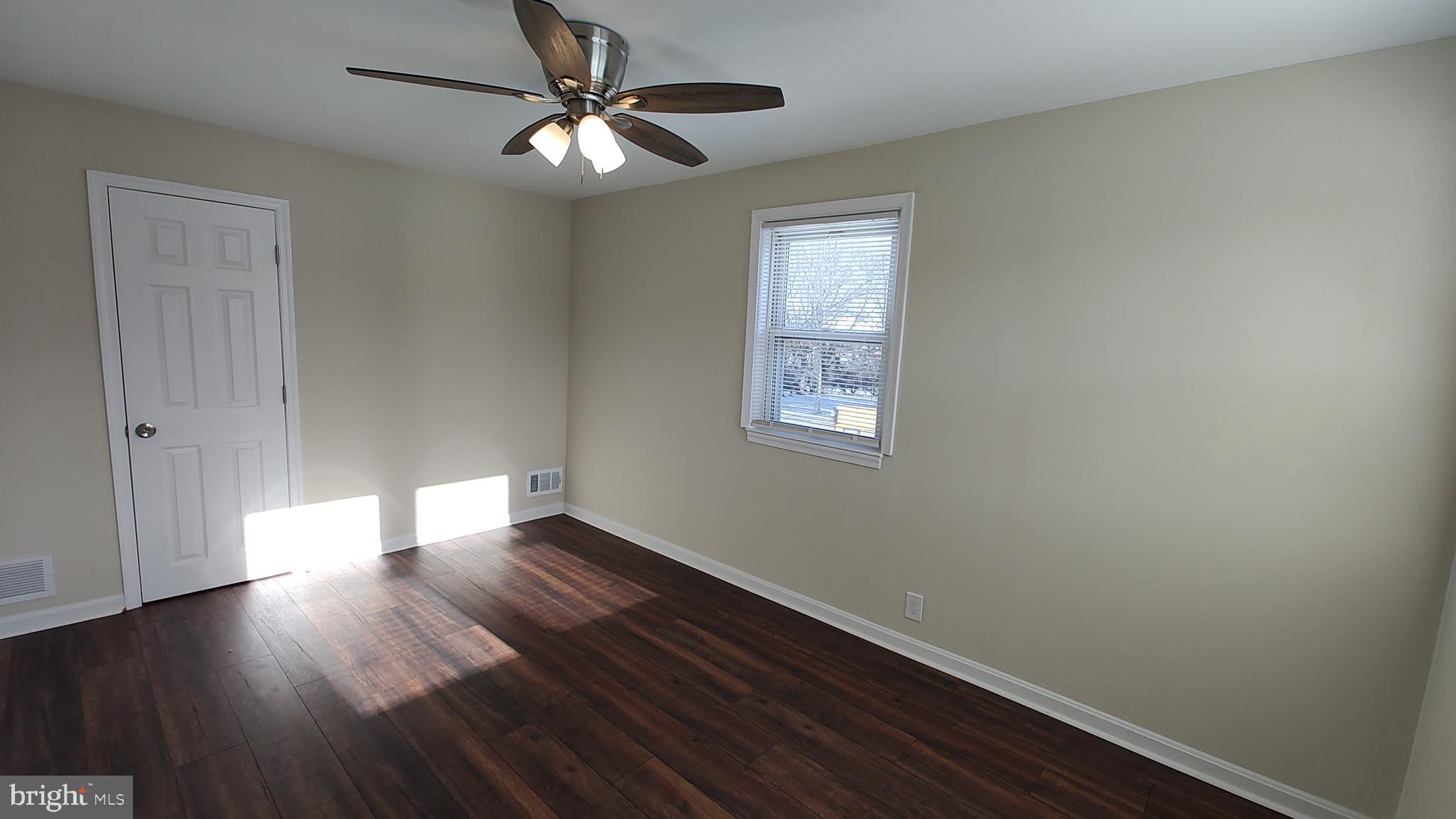 2247 Graythorn Road Middle River, MD 21220 - Photo 19 of 29 wooden floor in an empty room with a window