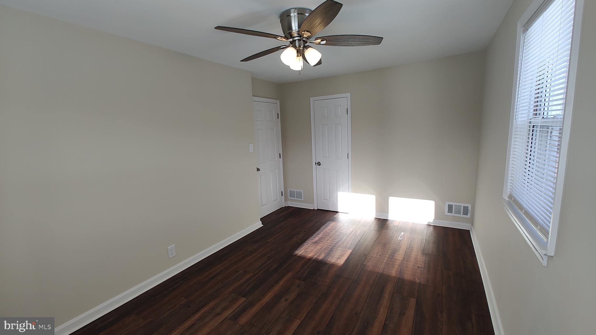 2247 Graythorn Road Middle River, MD 21220 - Photo 20 of 29 a view of empty room with wooden floor and fan