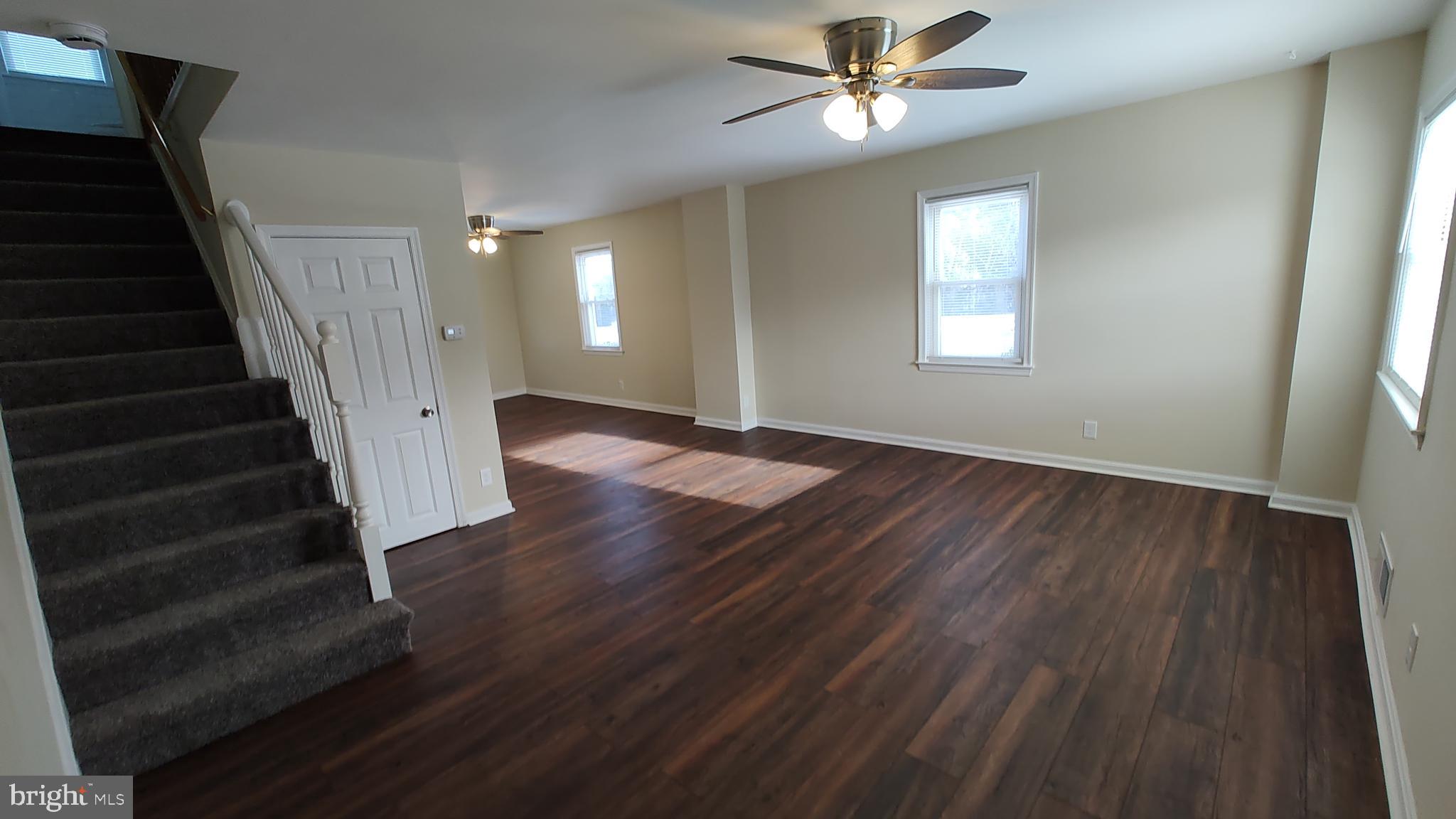 2247 Graythorn Road Middle River, MD 21220 - Photo 2 of 29 a view of an empty room with wooden floor and a ceiling fan
