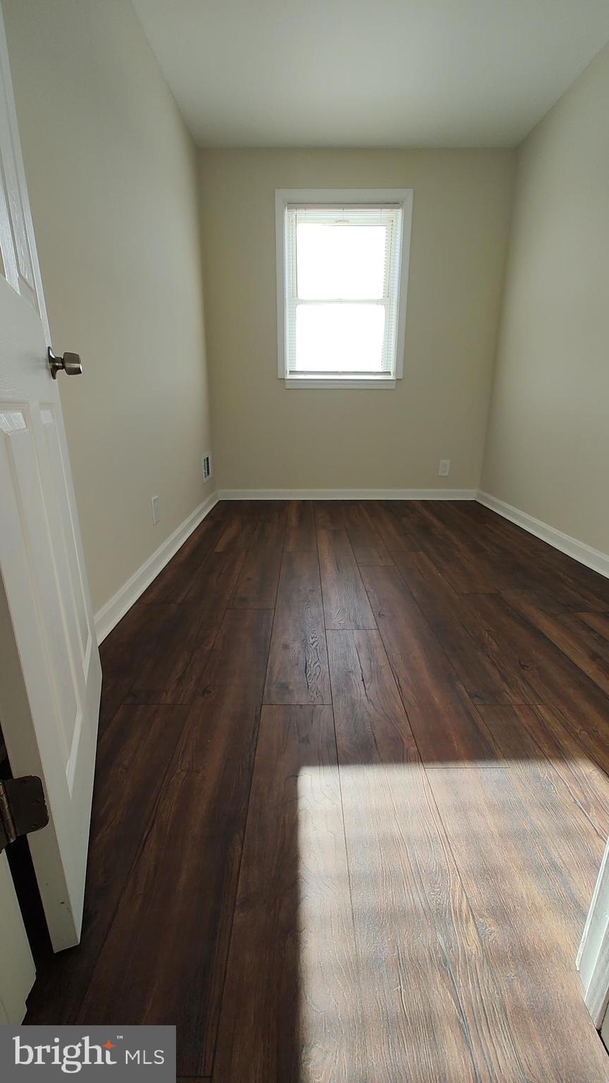 2247 Graythorn Road Middle River, MD 21220 - Photo 22 of 29 an empty room with wooden floor and front door