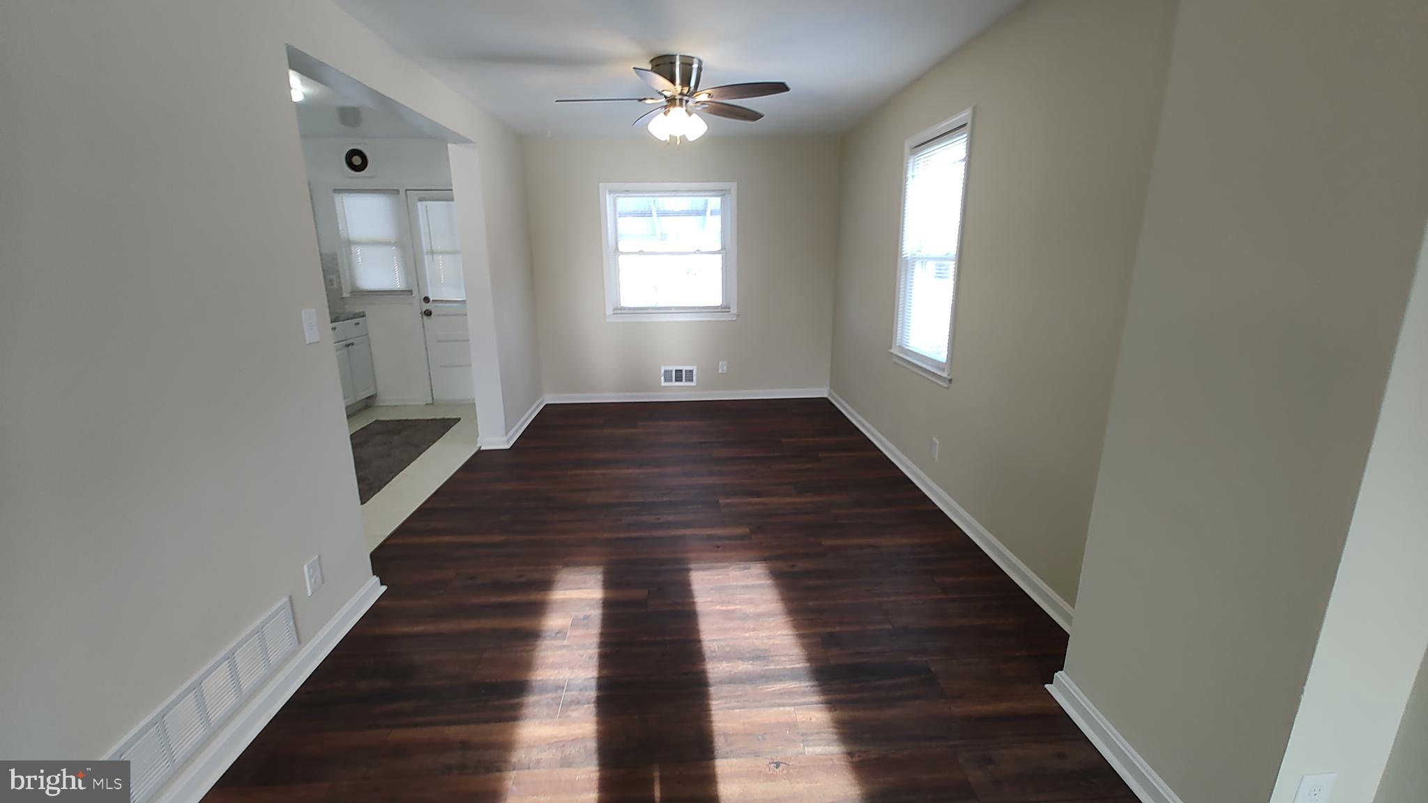2247 Graythorn Road Middle River, MD 21220 - Photo 4 of 29 a view of a hallway with wooden floor and staircase