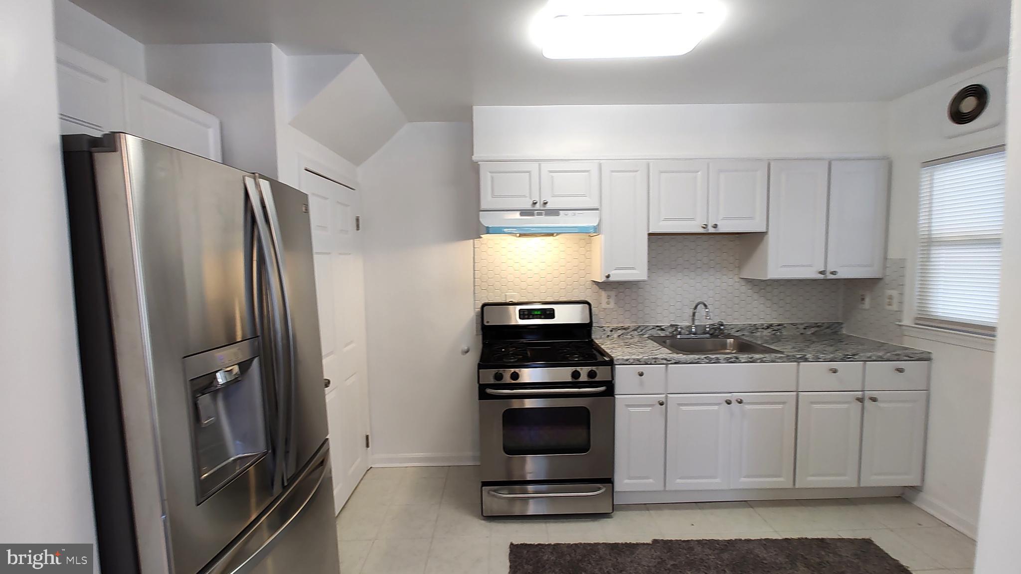 2247 Graythorn Road Middle River, MD 21220 - Photo 6 of 29 a kitchen with stainless steel appliances a sink stove and refrigerator