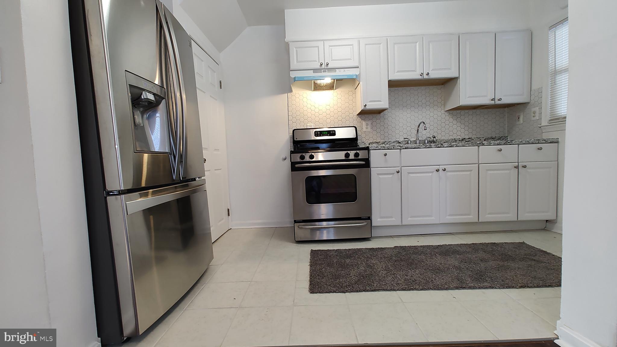 2247 Graythorn Road Middle River, MD 21220 - Photo 7 of 29 a kitchen with stainless steel appliances granite countertop a refrigerator stove and sink