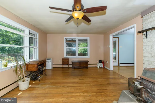 a living room with furniture and window with outer view