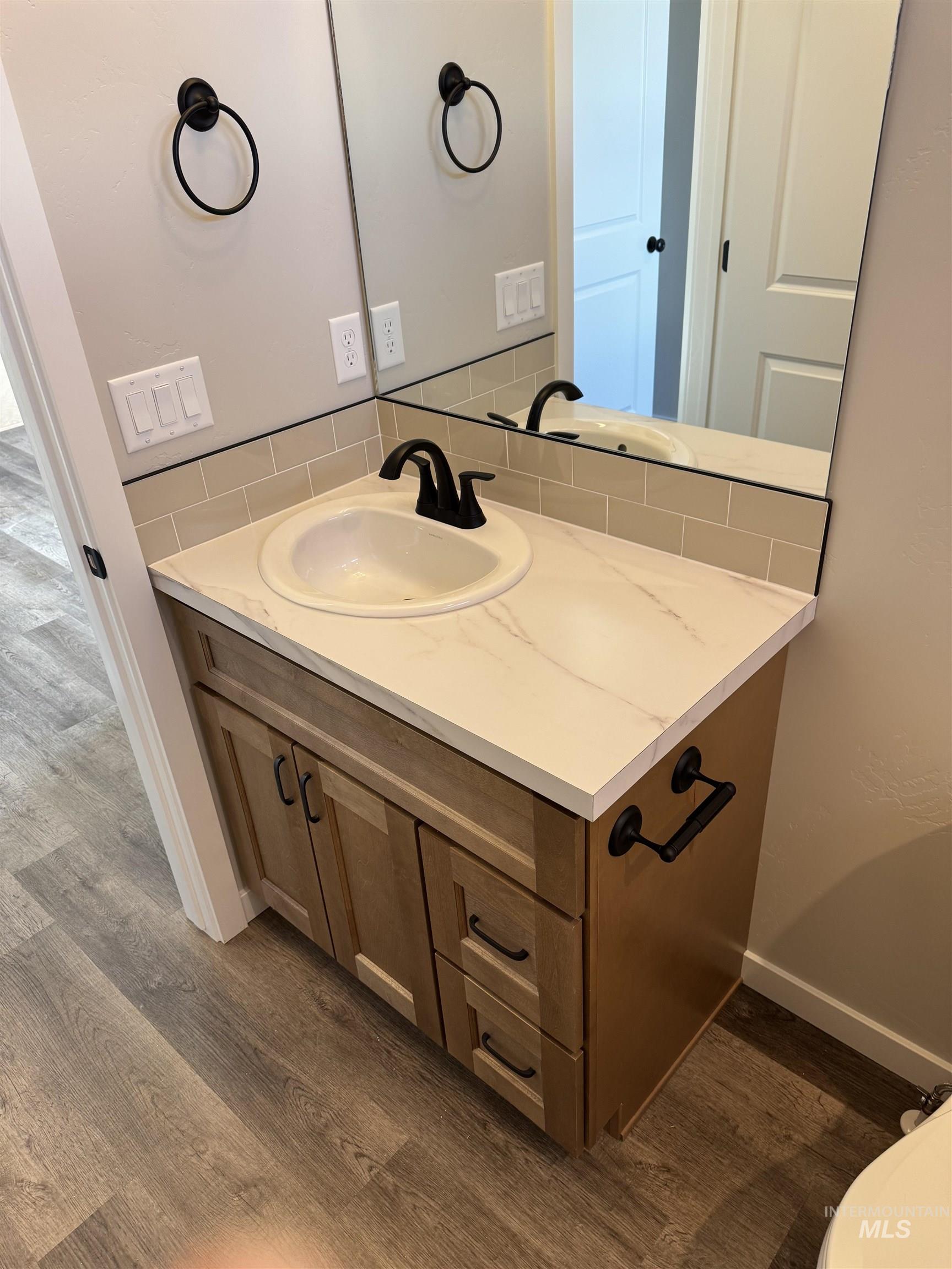 2064 Harrison Street South Twin Falls, ID 83301 - Photo 23 of 29 Bathroom featuring vanity and dark wood-type flooring