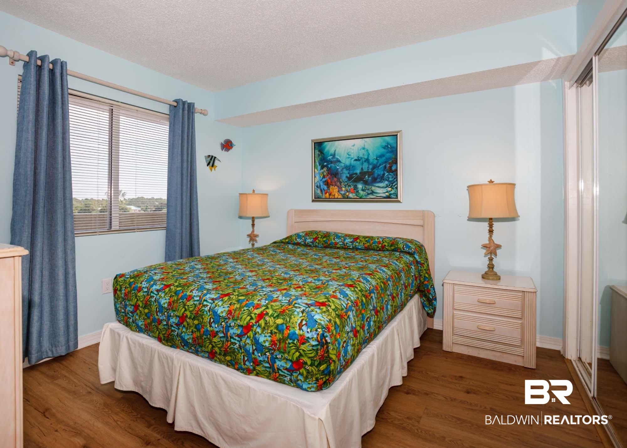 645 Plantation Road, Unit 6311 Gulf Shores, AL 36542 - Photo 9 of 43 Bedroom featuring wood finished floors, baseboards, and a textured ceiling