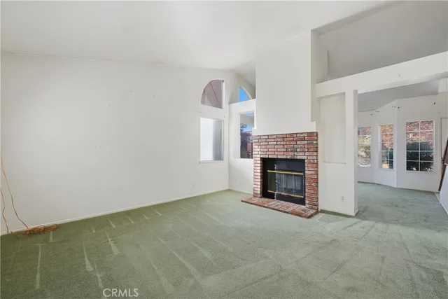 a view of a livingroom with a fireplace