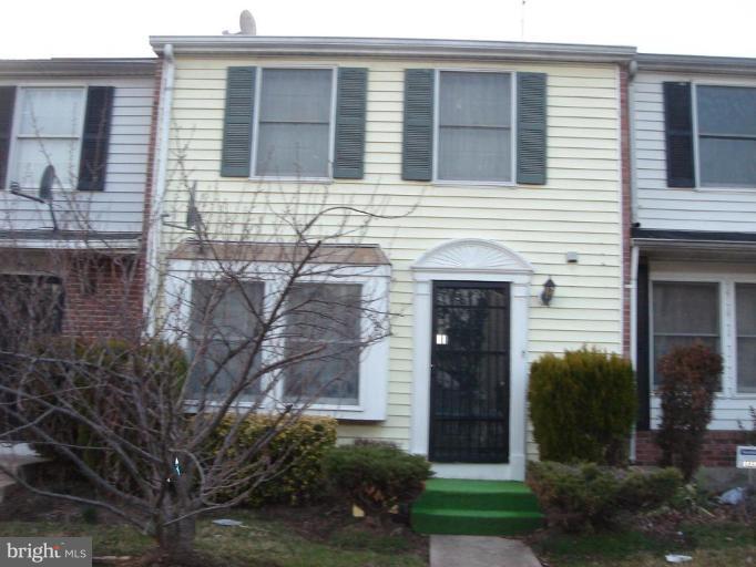 2524 Ridgely Street Baltimore, MD 21230 - Photo 1 of 1 a front view of a house with garden