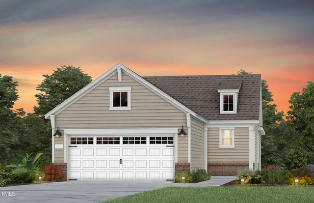 a view of a house with a yard and garage