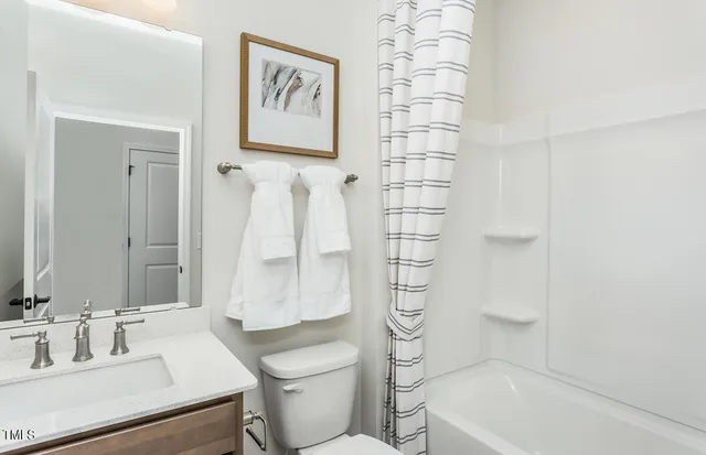 a bedroom with a bed and a table