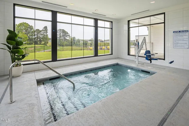 a view of a swimming pool with outdoor seating
